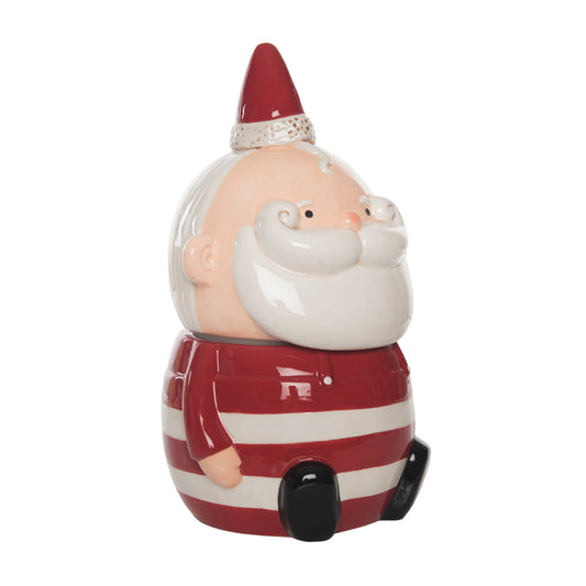 Decorative gnome figurine with a red hat and striped outfit on a white background