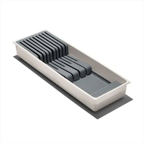 Rectangular plastic tray with slots for knives