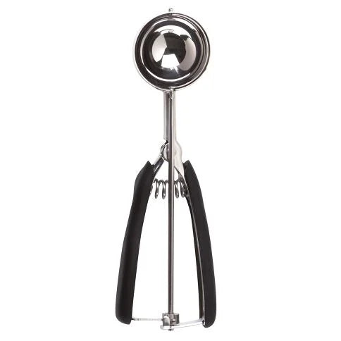 Metallic cookie or ice cream scoop with black handles on a white background