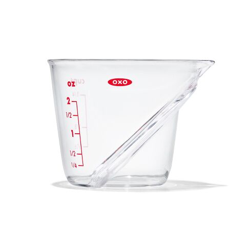 Clear measuring cup with red markings and OXO logo on a white background