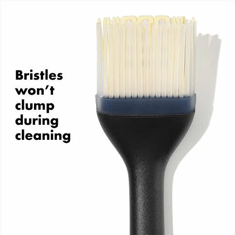OXO silicone basing brush 'Bristles won't clump during cleaning' on the left.