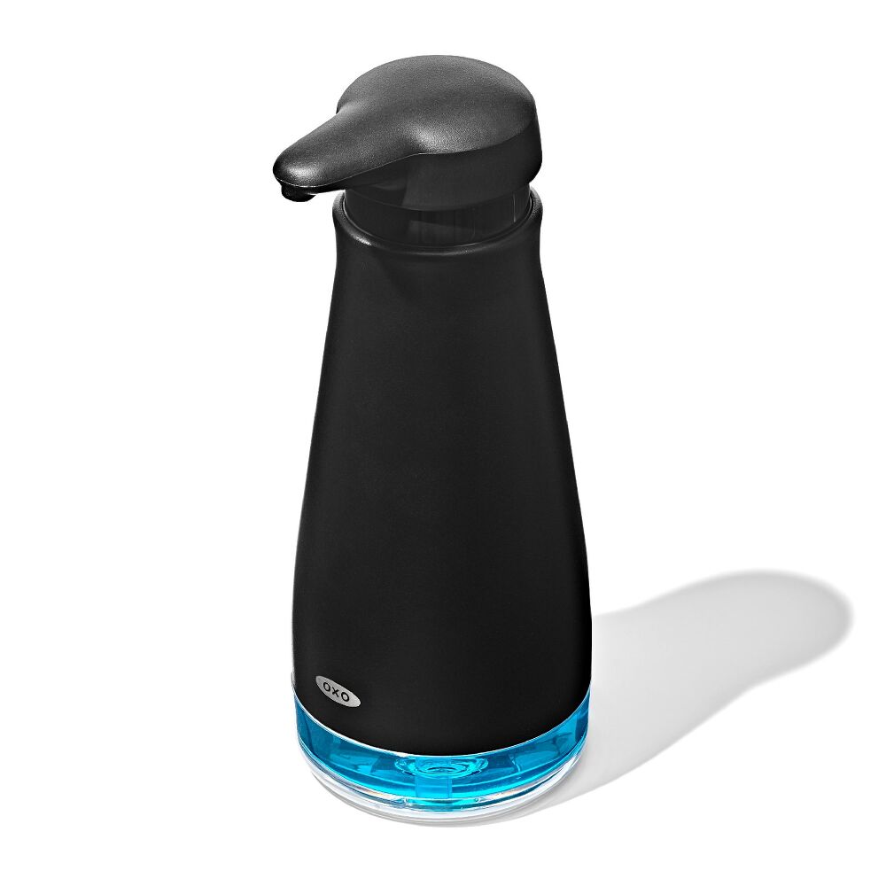 OXO Black soap dispenser with soap
 on a white background