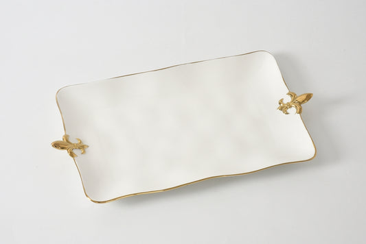 Rectangular white dish with gold handles on a light gray background