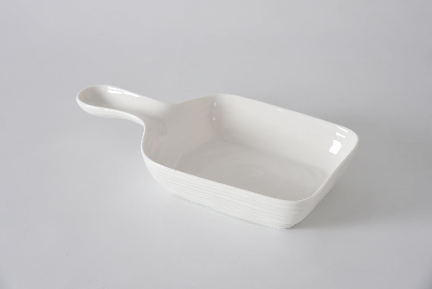 White ceramic dish on a light gray background