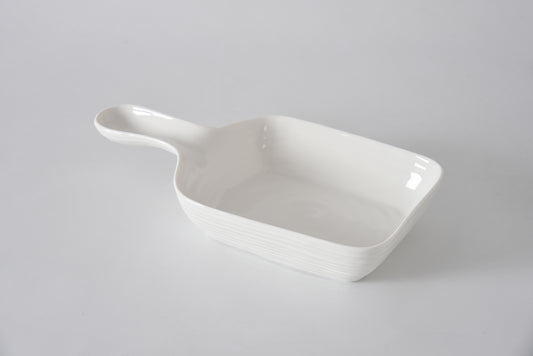 White ceramic dish on a light gray background