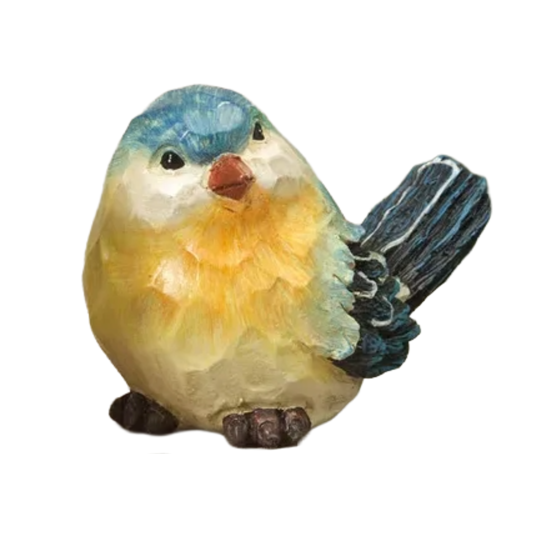 Colorful bird figurine with blue, yellow, and white feathers on a white background