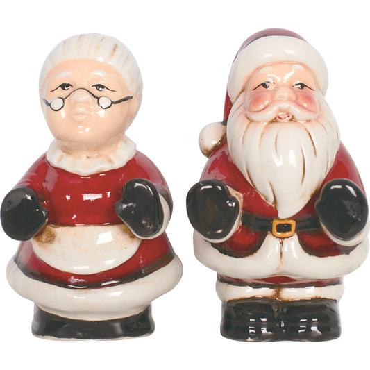 Two ceramic figures of Santa Claus and Mrs. Claus on a white background