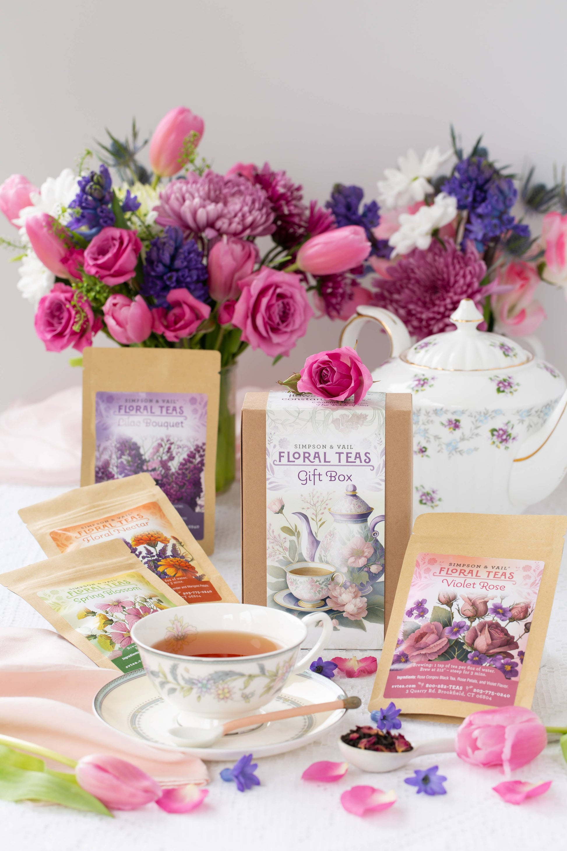 Tea packaging with a teacup, flowers, and a teapot on a white background