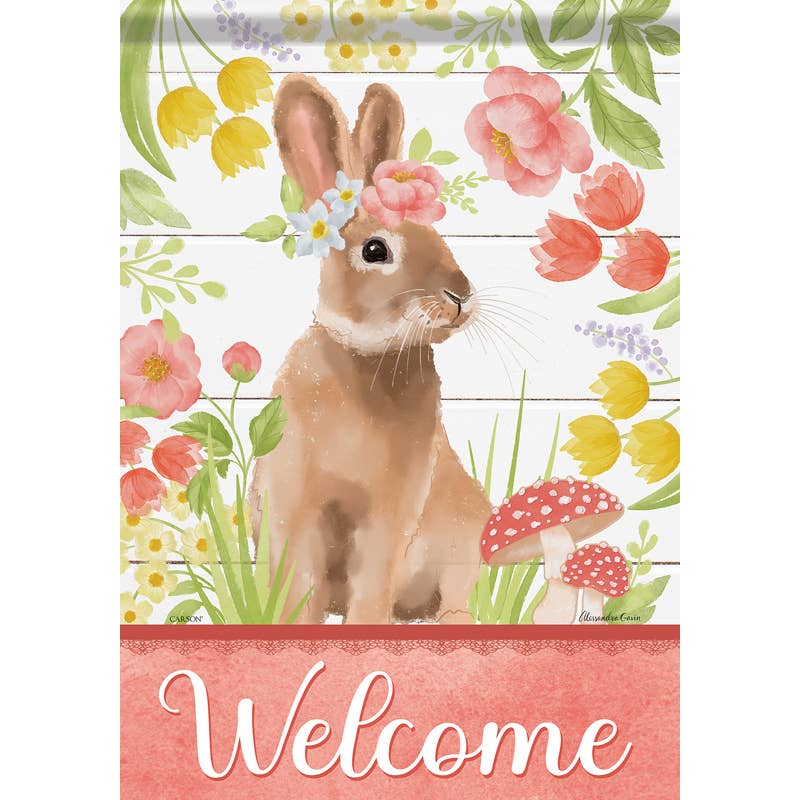 A garden flag featuring an illustration of a brown bunny with flowers on its head, surrounded by colorful flowers and mushrooms, with the word 'Welcome' displayed at the bottom.