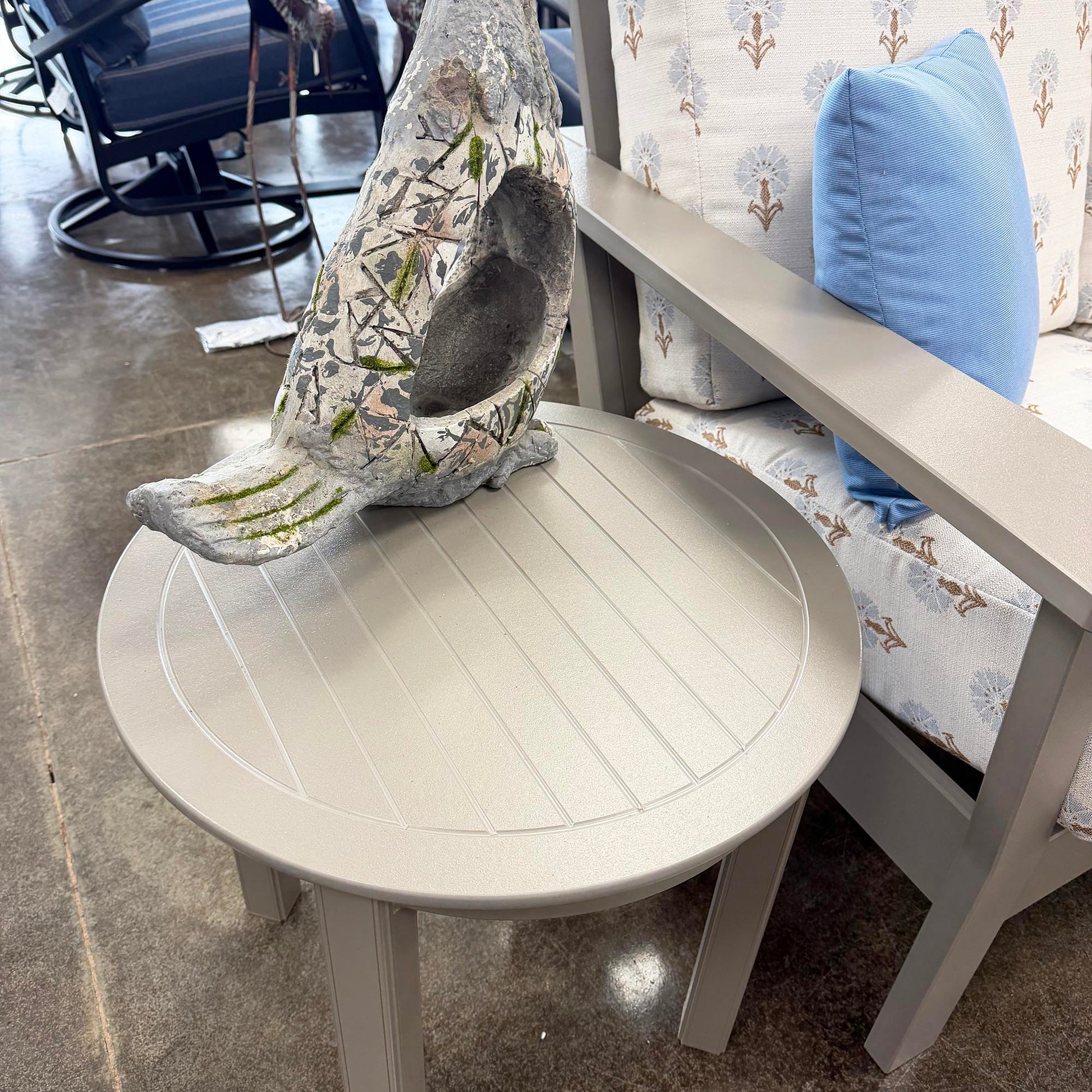 Round Telescope End table with decorative shell planter.