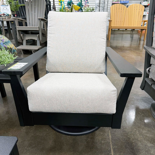 Chair with white cushion and black frame in an outdoor furniture store setting