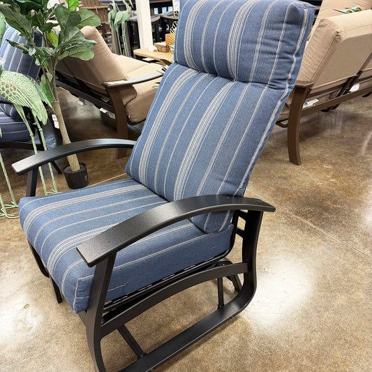 Blue striped chair with black frame in a store setting