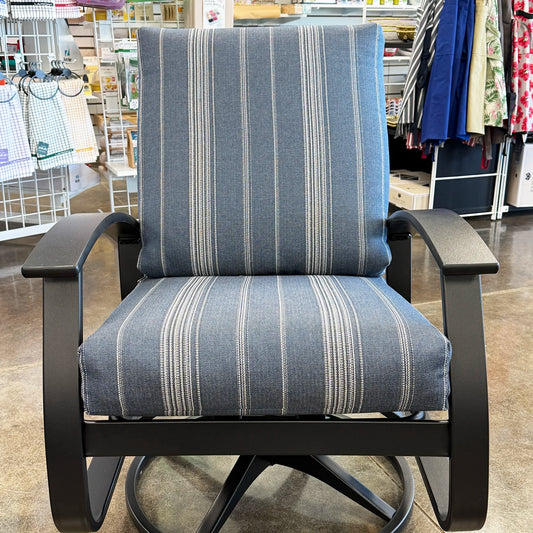 Blue striped chair with black frame in a store setting