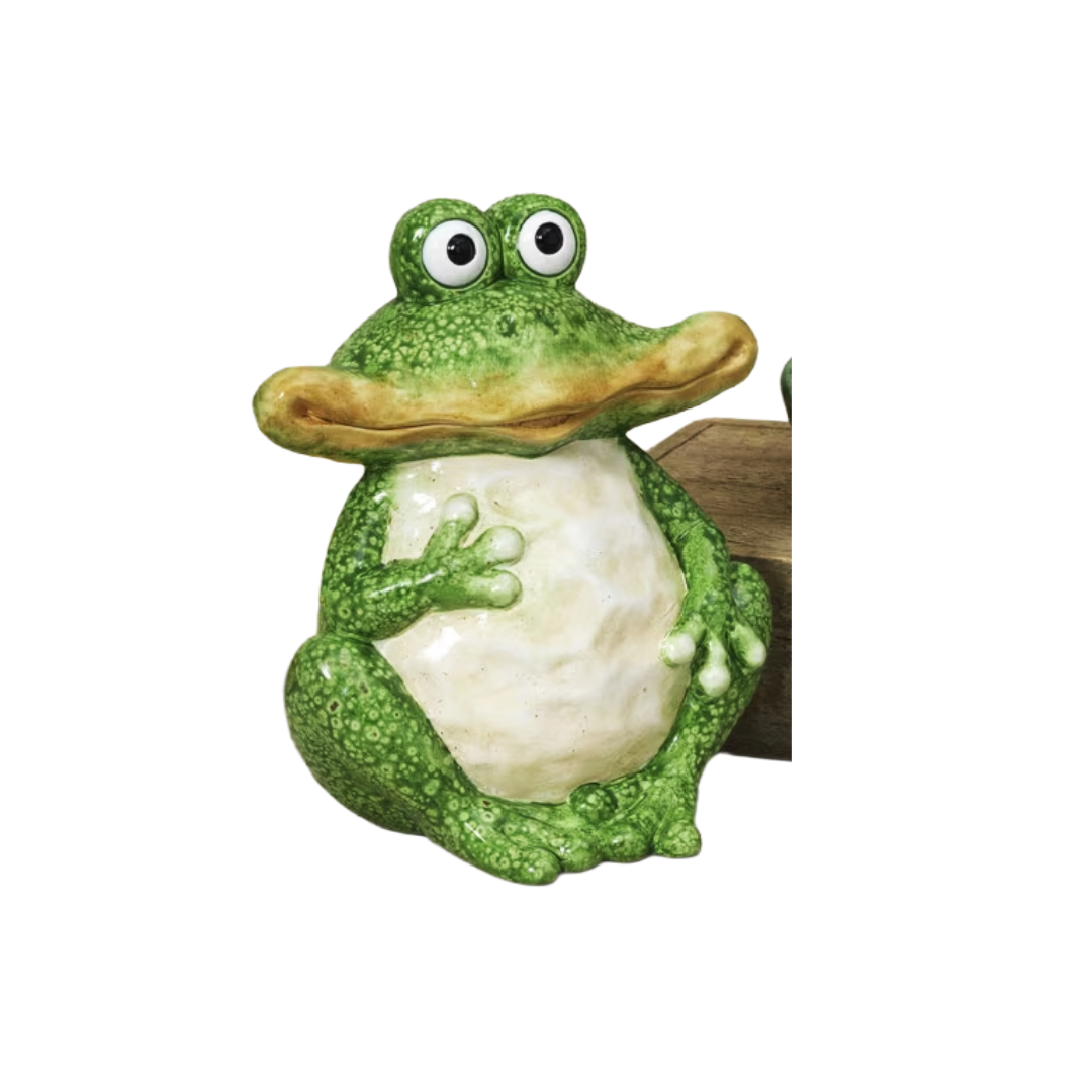 Green frog figurine with a white belly on a white background