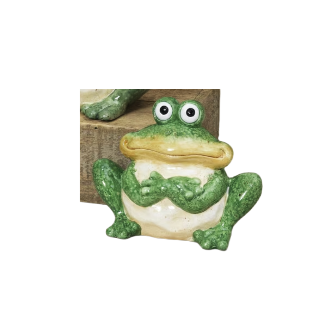 Frog figurine on a white background