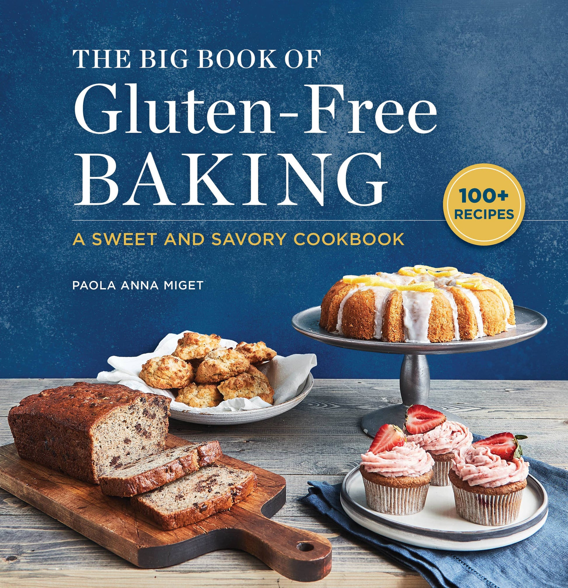 Book cover of 'The Big Book of Gluten-Free Baking' with baked goods on a table.