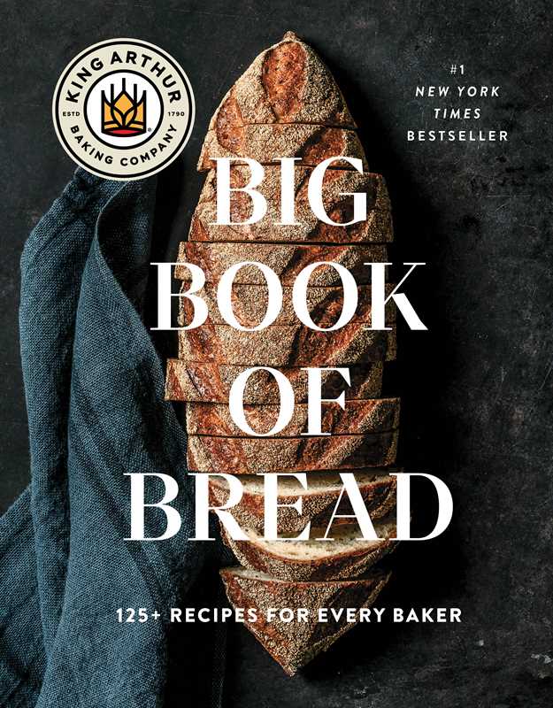 Book cover of 'Big Book of Bread' by King Arthur Baking Company with a loaf of bread and blue towel on a dark background.