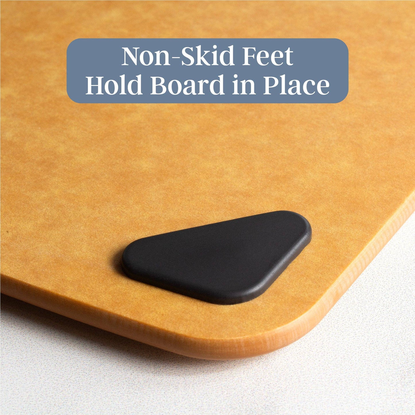 Bamboo cutting board with a black non-skid foot on a white background