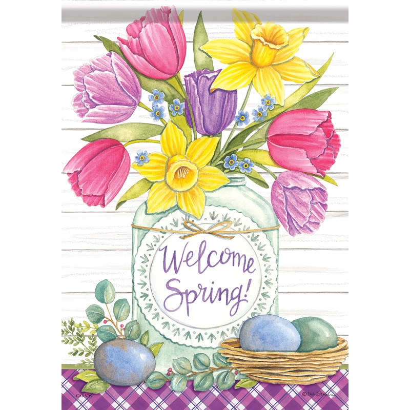 A garden flag with a floral design, featuring tulips and the text 'Welcome Spring!' displayed.