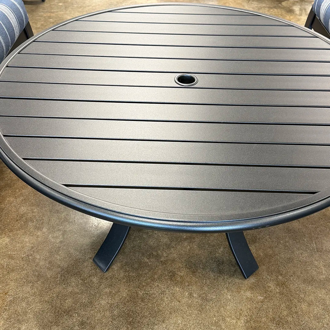 Round metal table on a concrete surface
