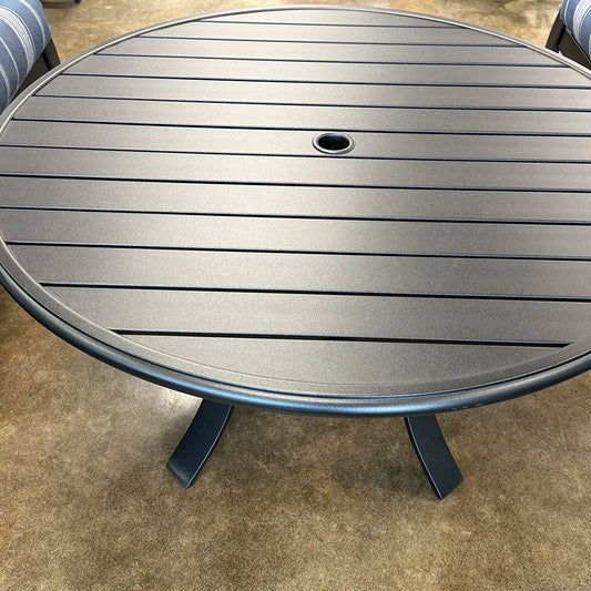 Round metal table on a concrete surface