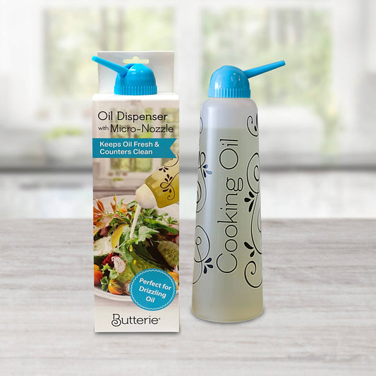 Butterie cooking oil dispenser with packaging on a neutral background