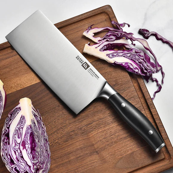 Arcelor Cleaver Knife on a wooden cutting board with sliced purple cabbage