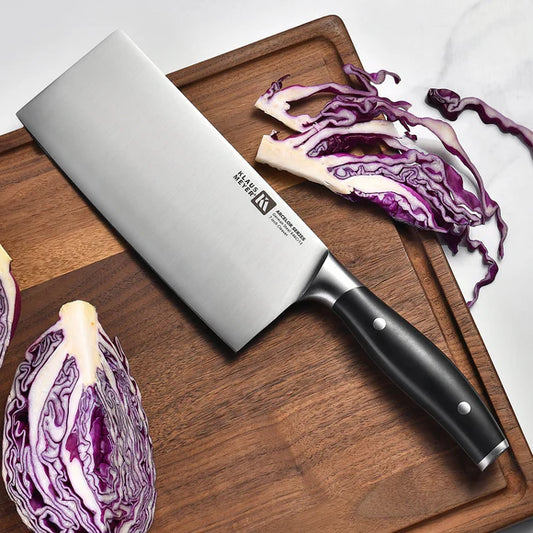 Arcelor Cleaver Knife on a wooden cutting board with sliced purple cabbage