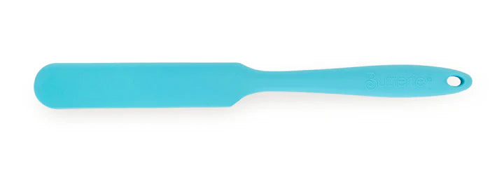 Blue spatula on a white background