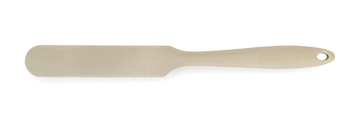 Beige spatula on a white background