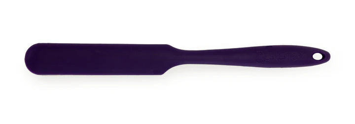 Purple spatula on a white background