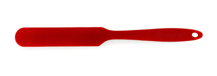 Red spatula on a white background