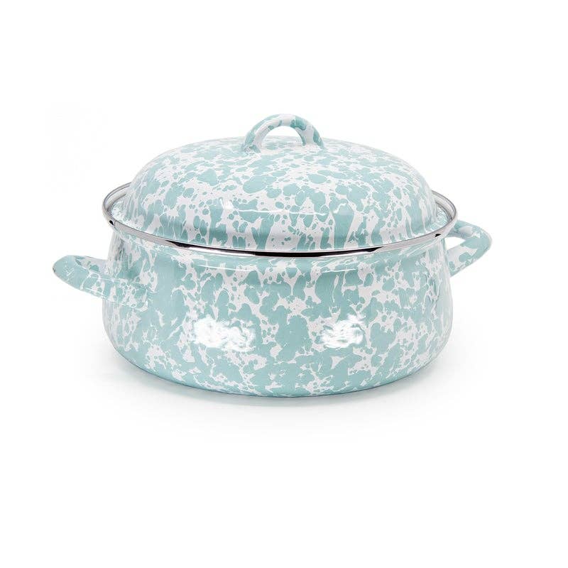 Turquoise and white speckled cookware on a white background