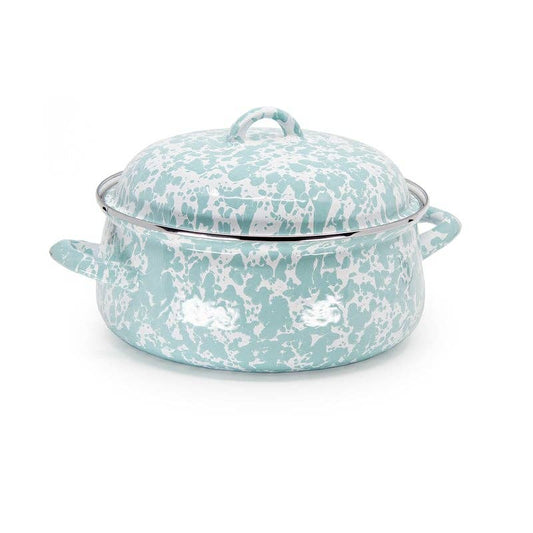 Turquoise and white speckled cookware on a white background