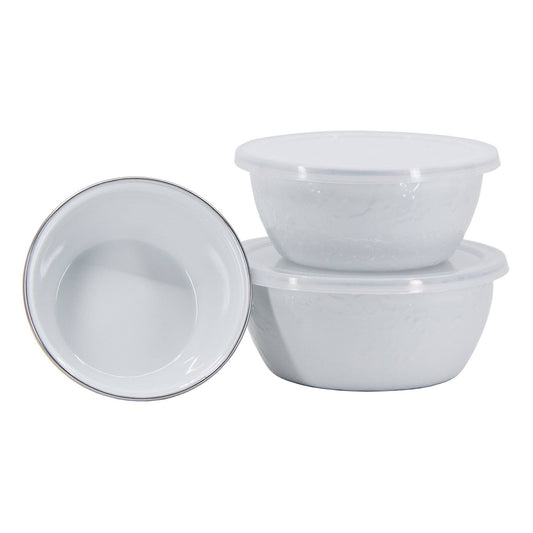 Set of white porcelain enamel bowls on a white background