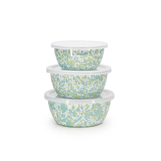 Set of three spatter-patterned bowls stacked on a white background