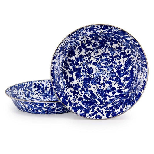 Two blue and white speckled enamelware  pie pan on white background