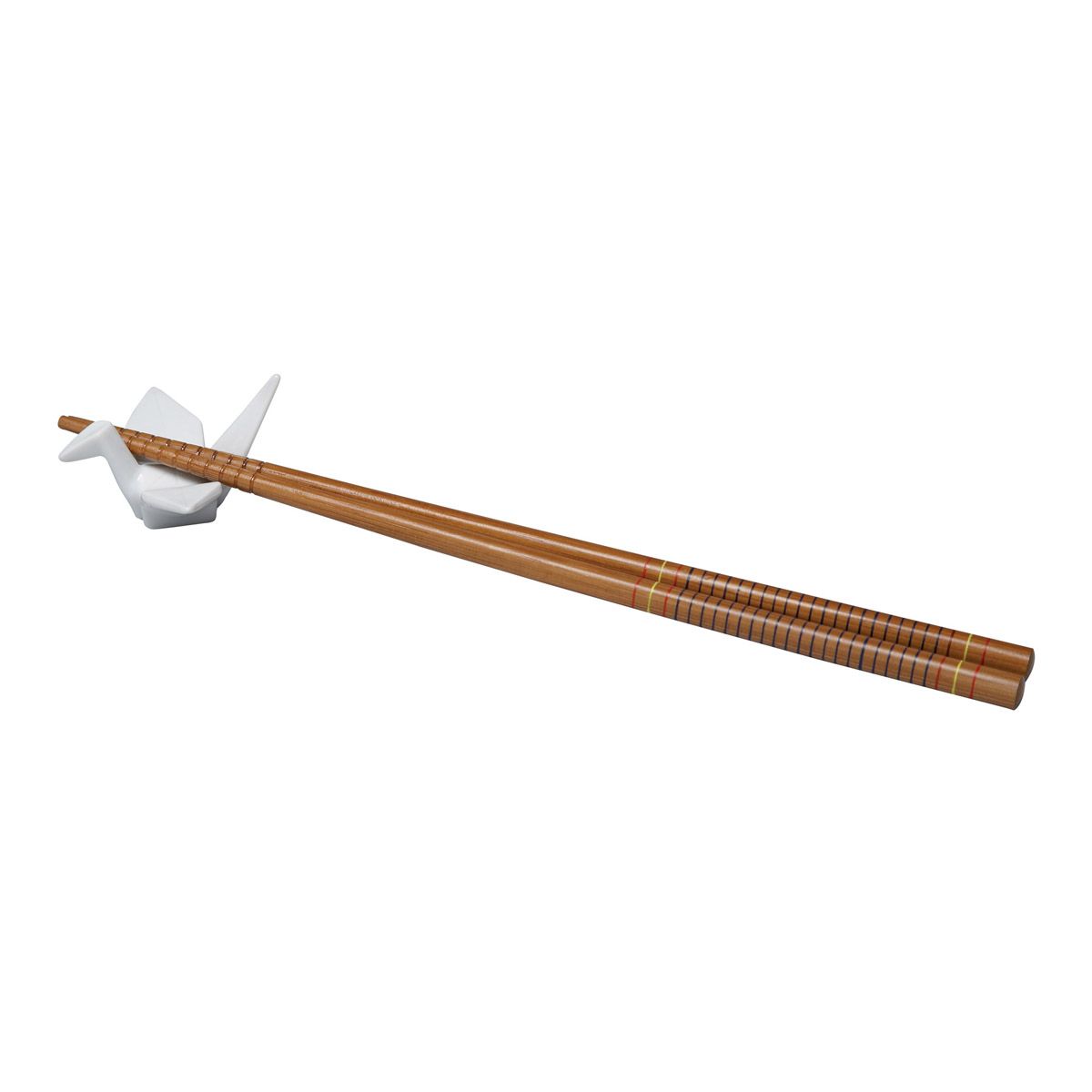 Pair of wooden chopsticks resting on a ceramic crane-shaped figurine on a white background
