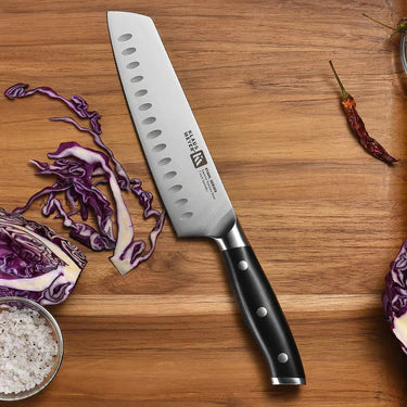 Klaus Meyer Stahl Santuko knife on a wooden cutting board with vegetables