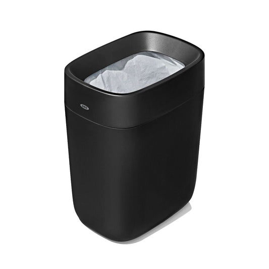 OXO Good Grips Black trash bin with a white liner on a white background