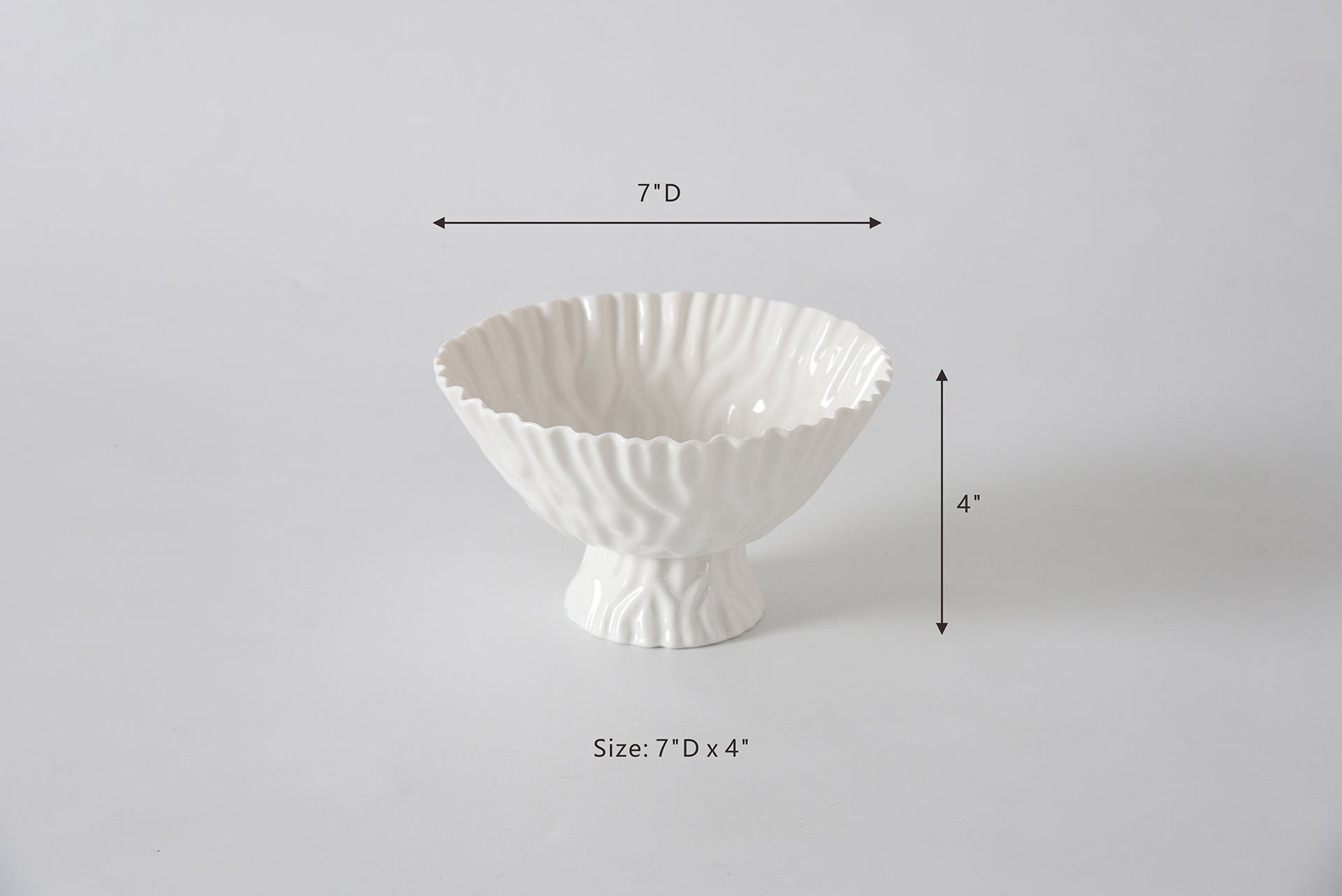 White decorative bowl with dimensions on a gray background