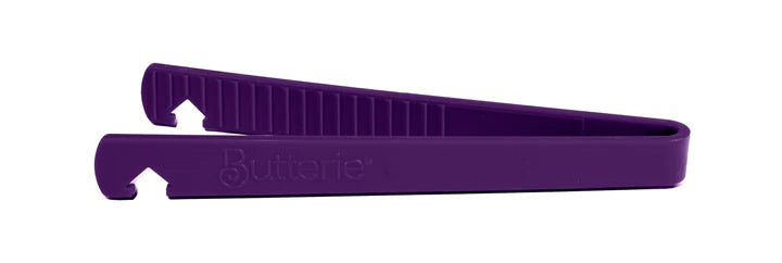 Purple toaster tong on a white background