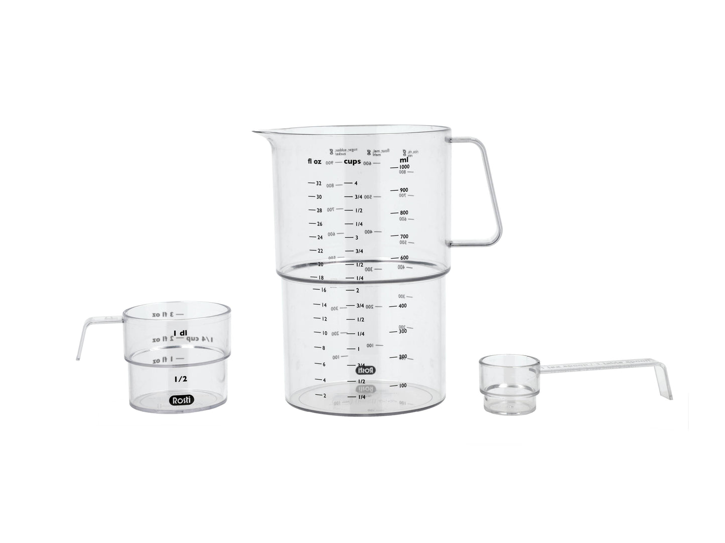 Set of glass measuring cups with handles on a white background