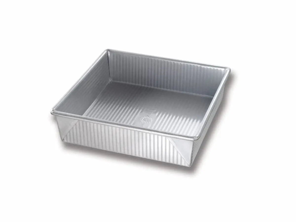 Square metal baking pan on a white background
